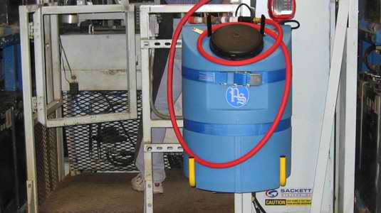 A blue charger mounted water supply in a warehouse
