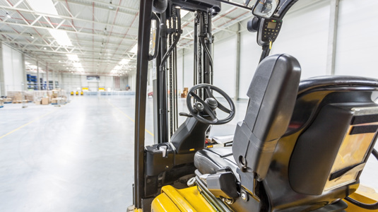Forklift truck charging in a warehouse