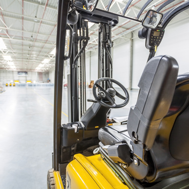 Forklift truck charging in a warehouse