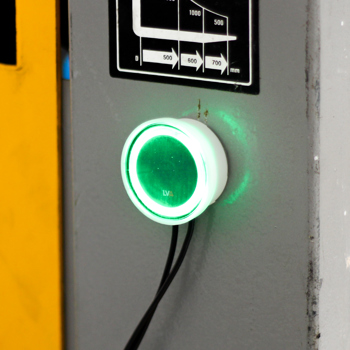 An LVA installed on a VRLA battery showing a green indication