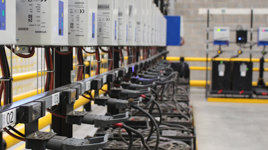 A forklift truck battery room full of lead acid batteries on charge